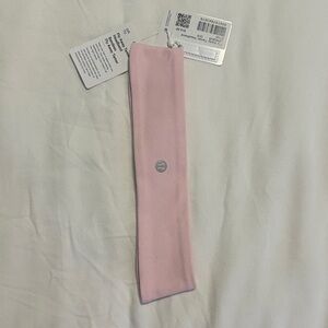 Lululemon Fly Away Tamer light Pink Headband with Logo.